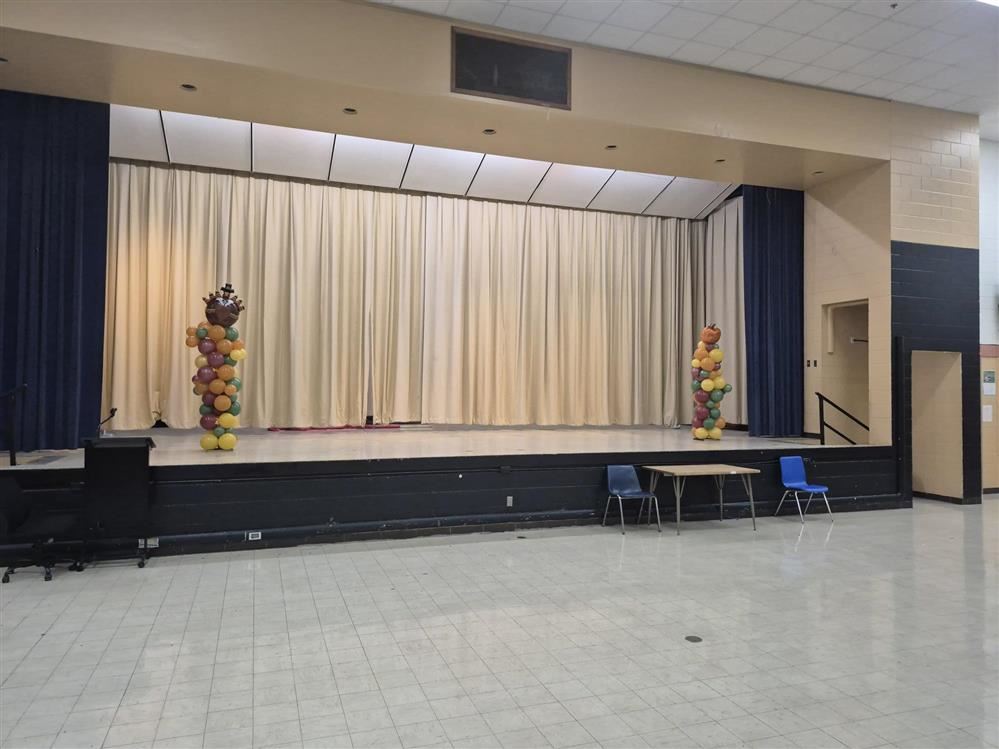  The cafeteria stage decorated for the black and gold dance